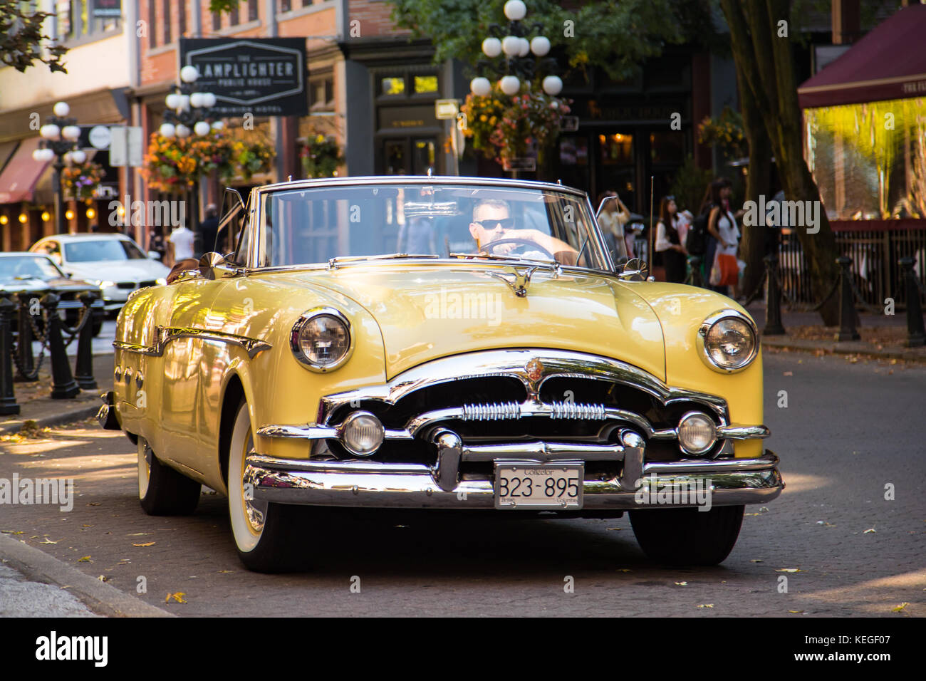 yellow-1953-packard-mayfair-automobile-with-classic-car-collectors-KEGF07.jpg