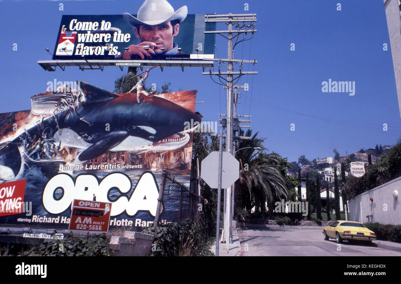 Marlboro billboard over Orca movie billboard on the Sunset Strip in Los Angeles, CA circa 1977 Stock Photo