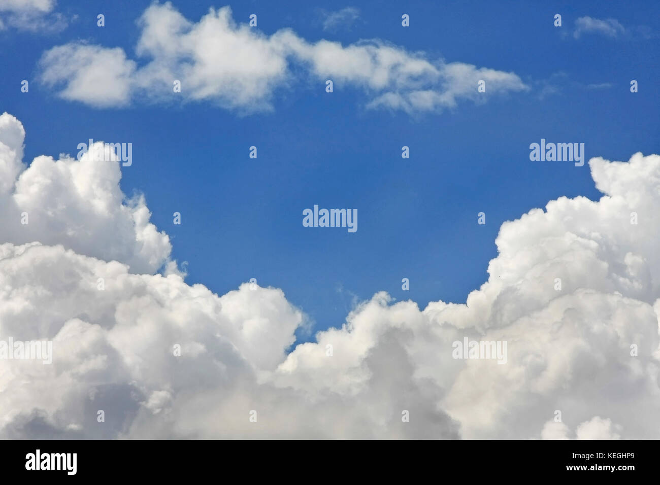 Blue sky background with thick white clouds Stock Photo - Alamy