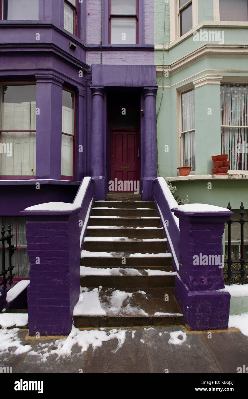 House entrance with purple facade and staircase Stock Photo - Alamy