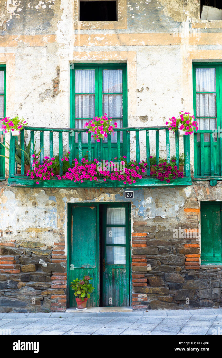 Traditional Basque architecture with geraniums in window box in the Biskaia Basque region of Northern Spain Stock Photo