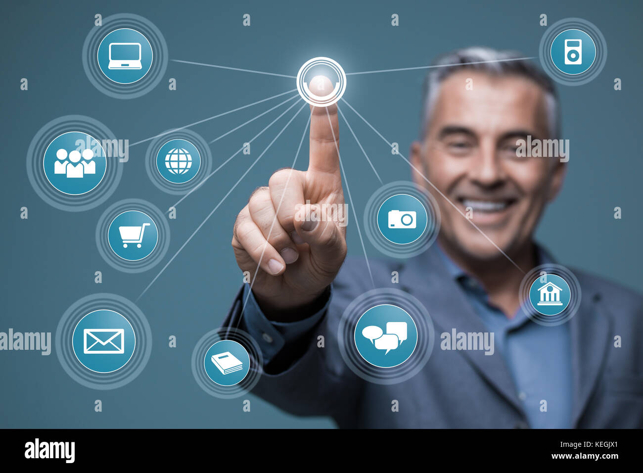 Smiling businessman using a virtual interface with app icons, he is ...