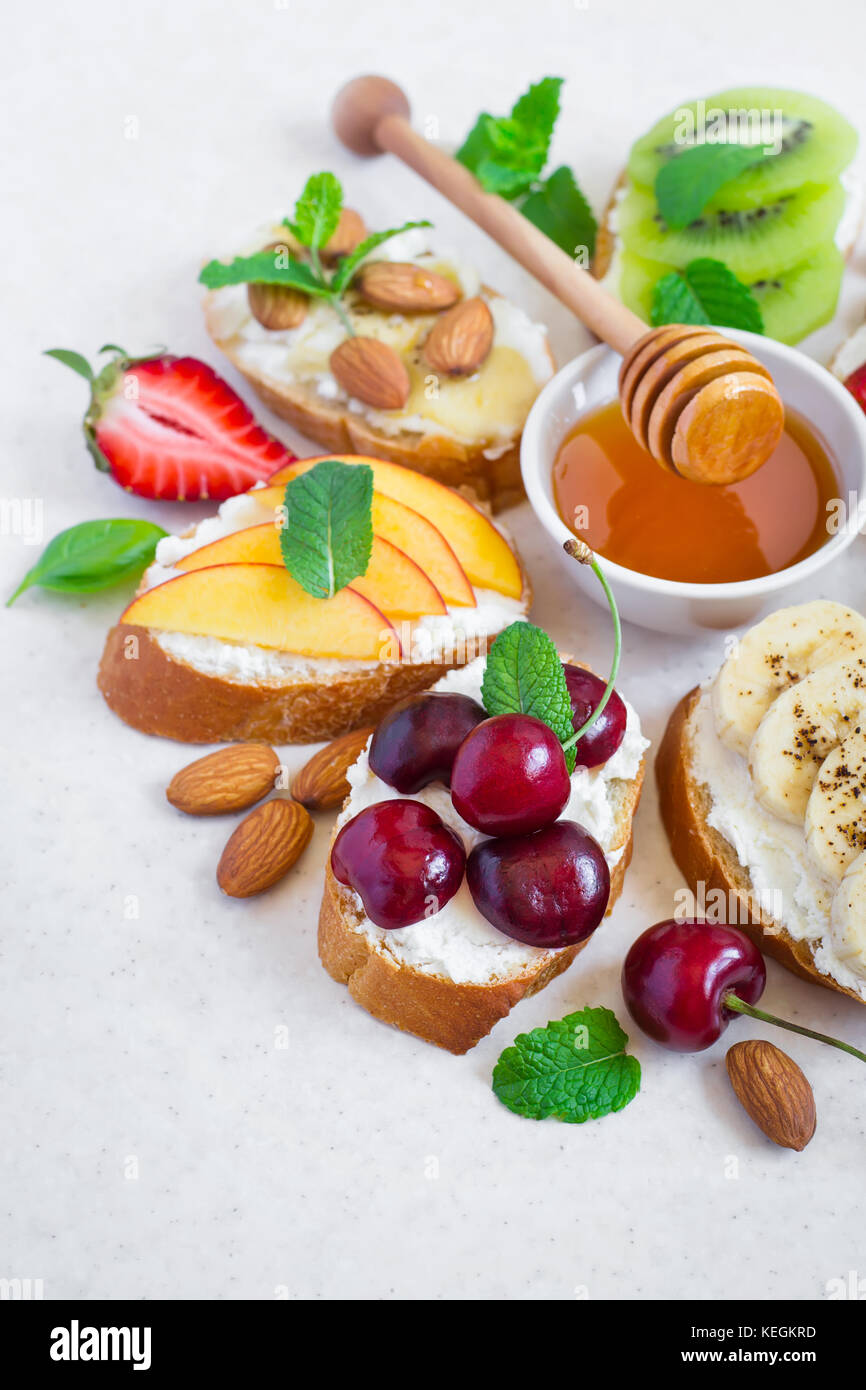 selection summer sweet snacks. Bruschetta or sandwiches with fruit and