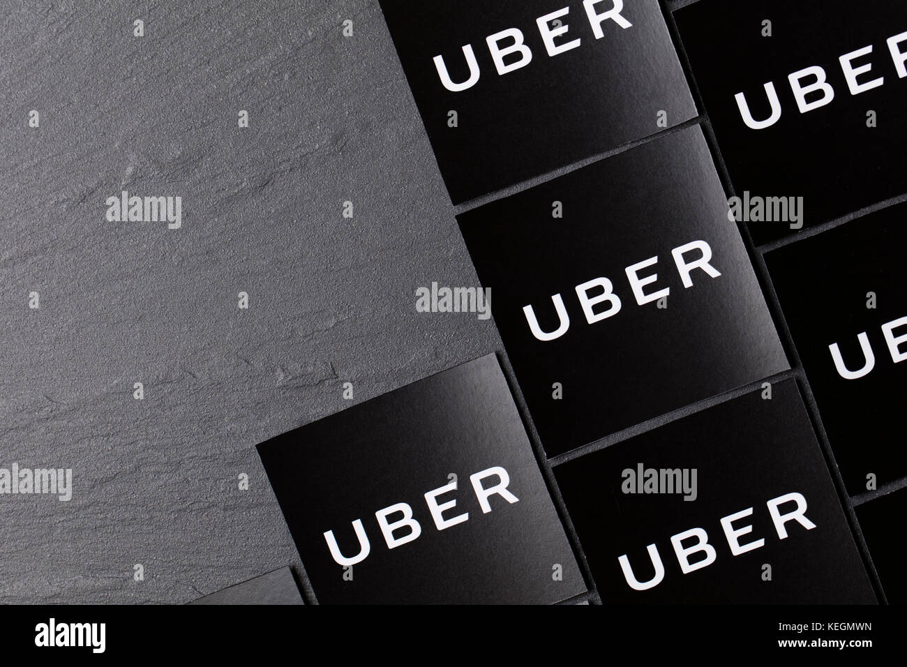 A photograph of  the Uber logo. Uber is a popular taxi style transport service application, founded in 2009 Stock Photo