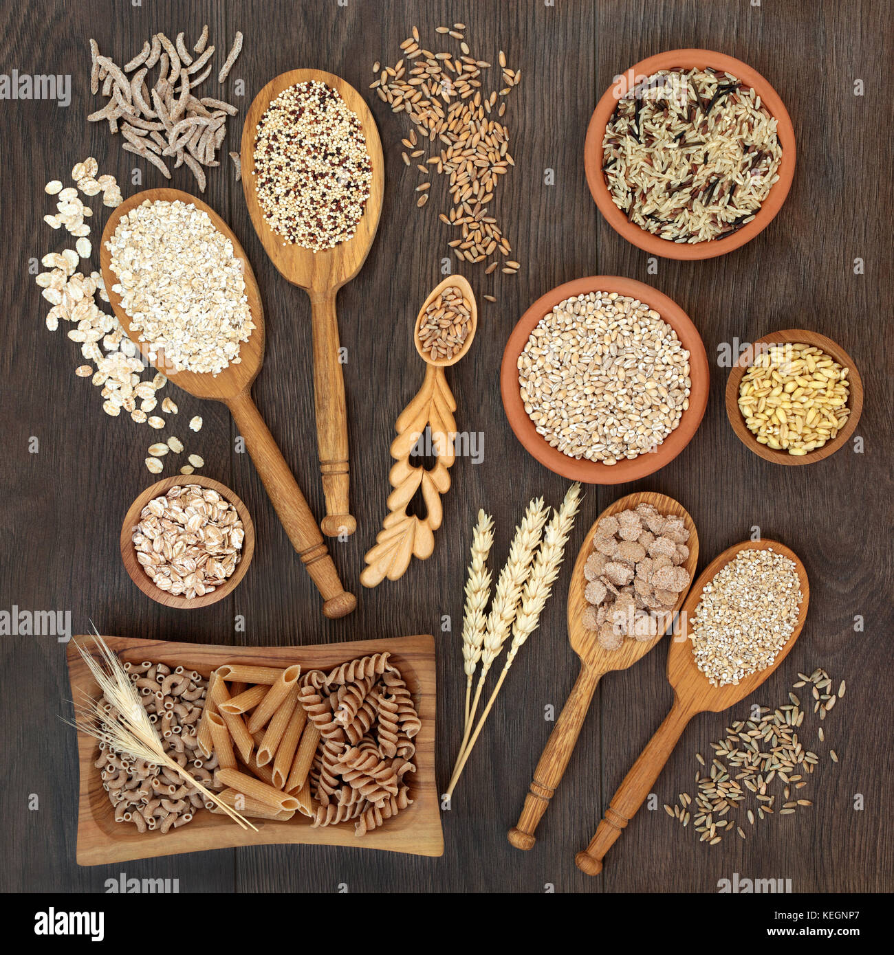 High fiber health food of whole wheat pasta, cereal and grains in bowls