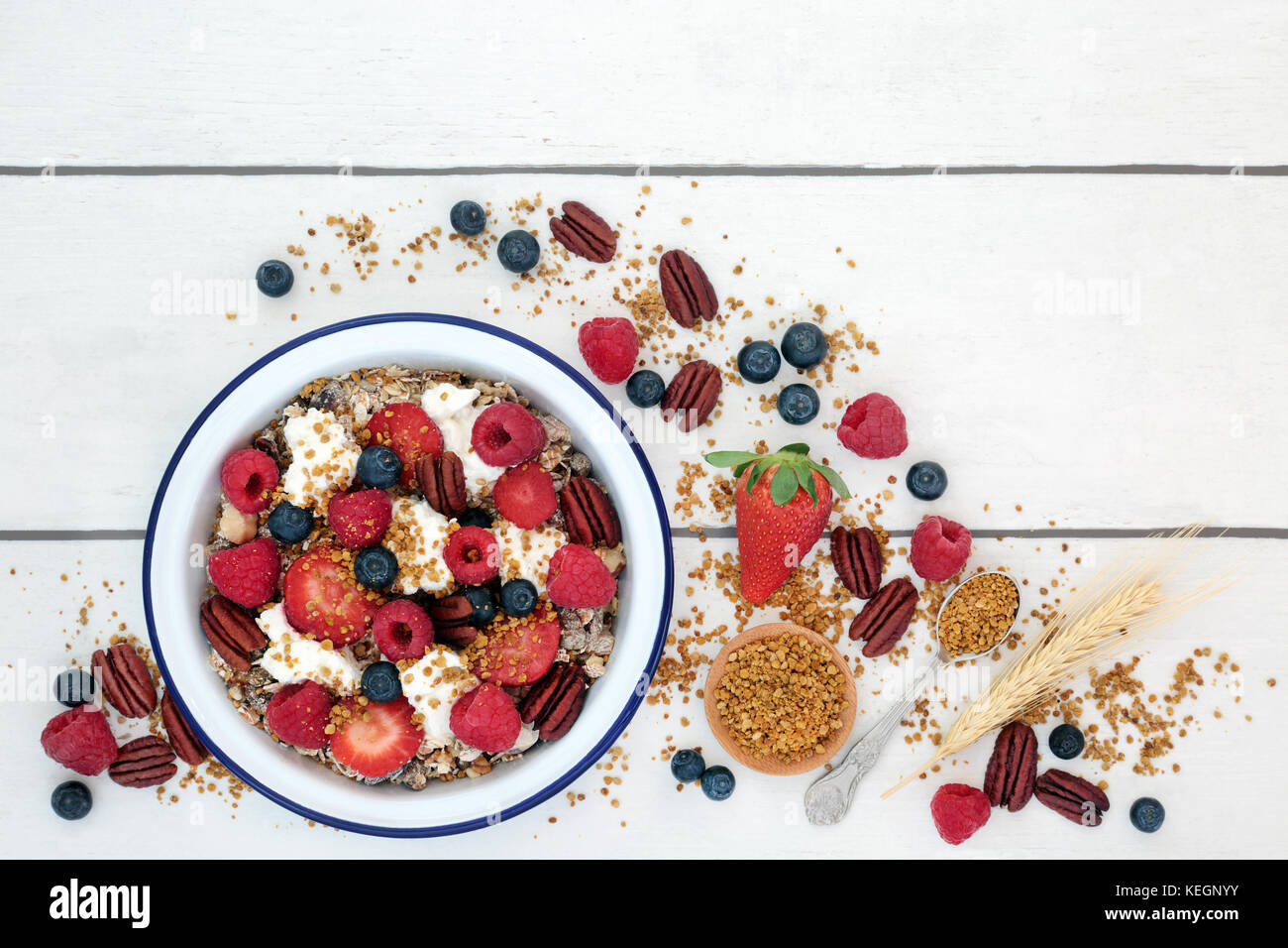 Healthy fresh breakfast concept with granola, pollen grain, yoghurt