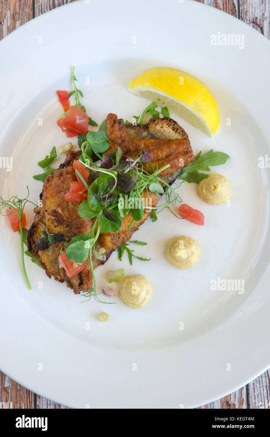 Chermoula sardines on toast with anchovy butter and celeriac pine nut