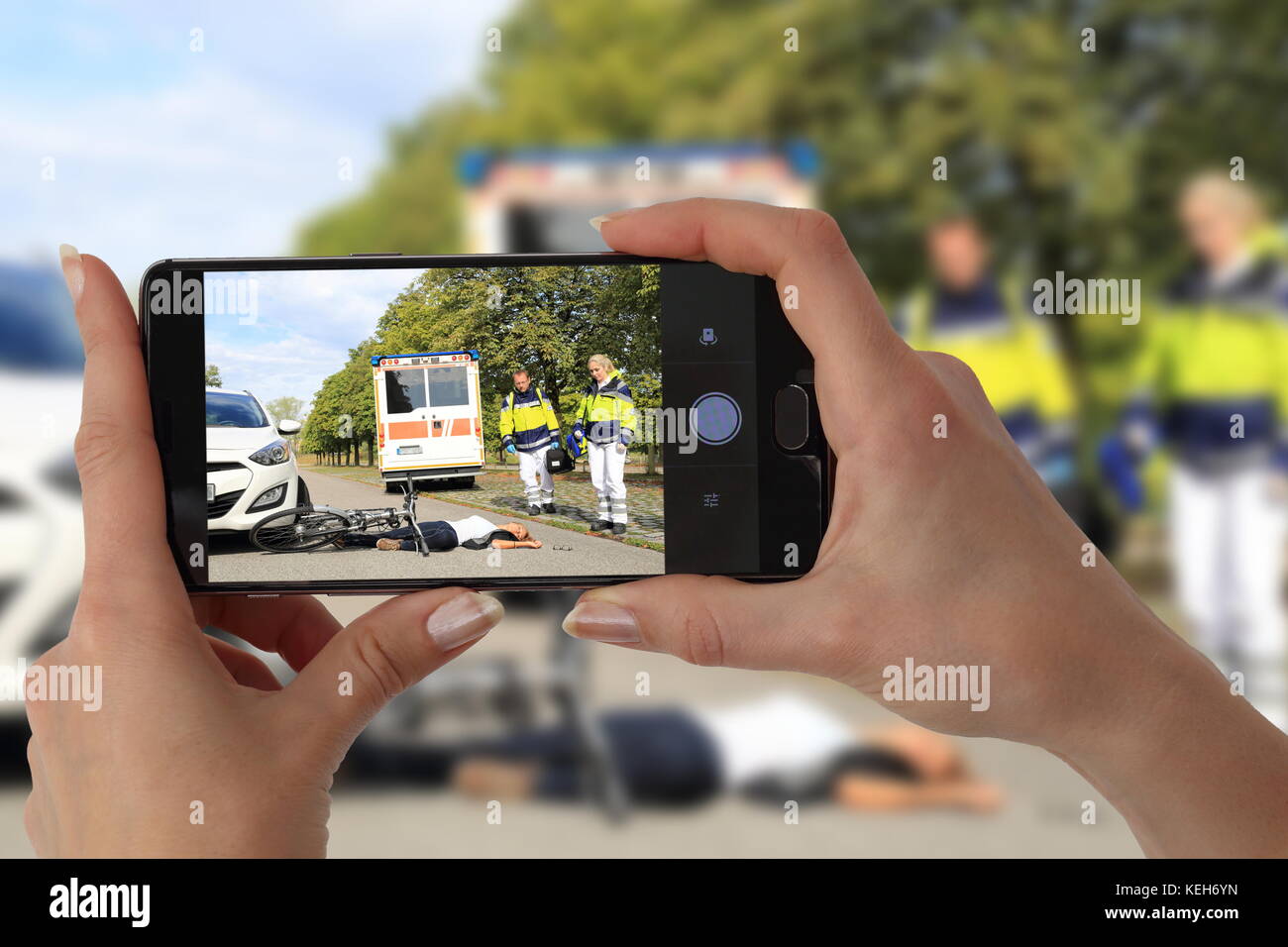 A Gawping Onlooker taking picture of an accident Stock Photo