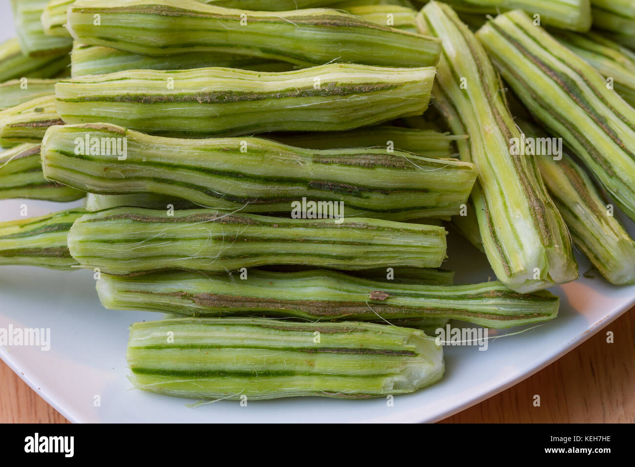 Horse radish tree, Drumstick or Moringa in the plate on wooden table Stock Photo