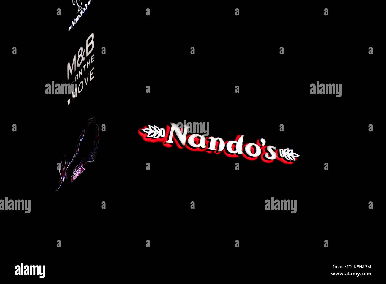 A South African Nando's restaurant at night Stock Photo