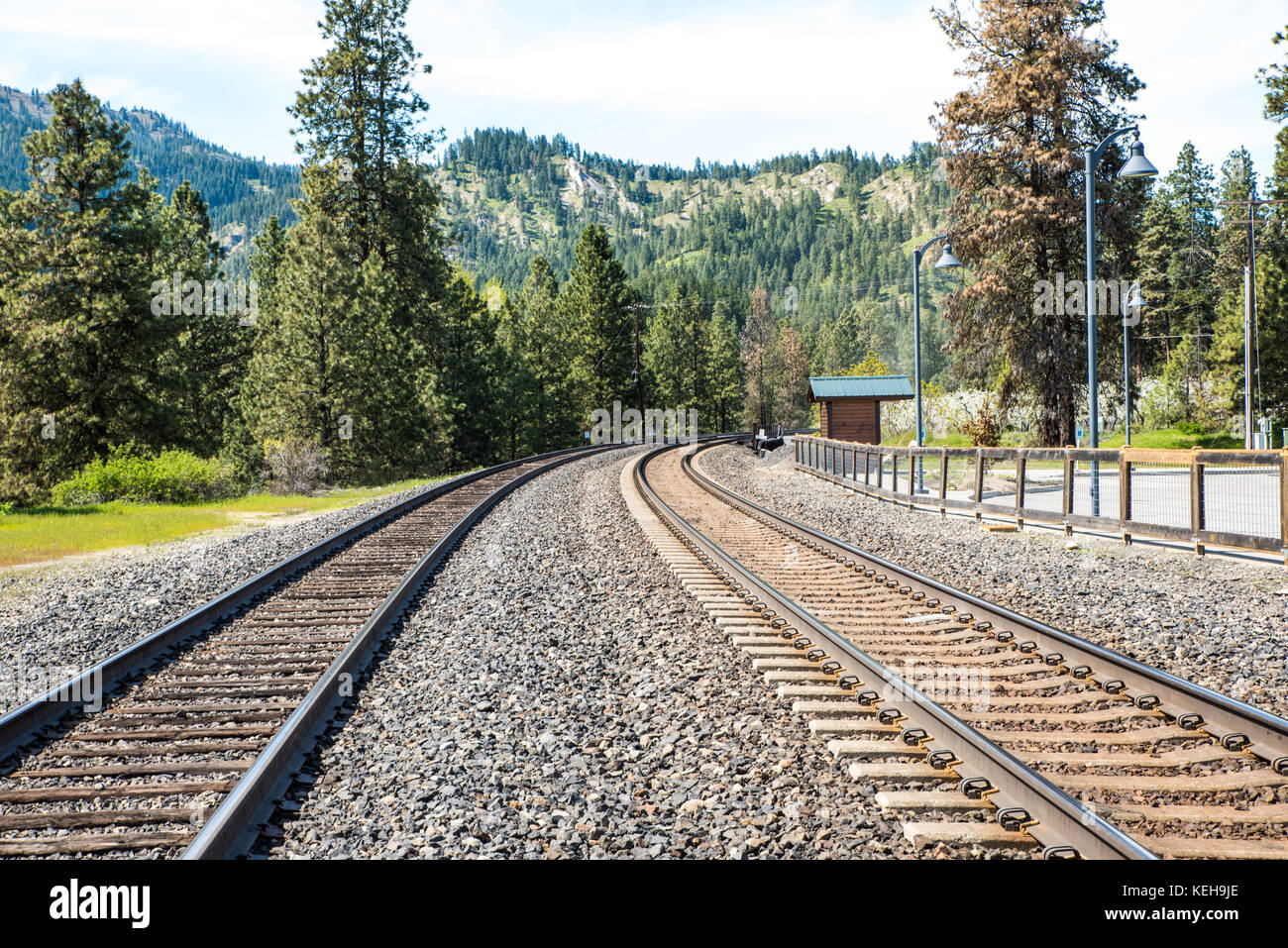 Round The Bend - Train tracks can be metaphors for the unknown future, leading to a distant, unknown horizon, the place where dreams are made. Stock Photo