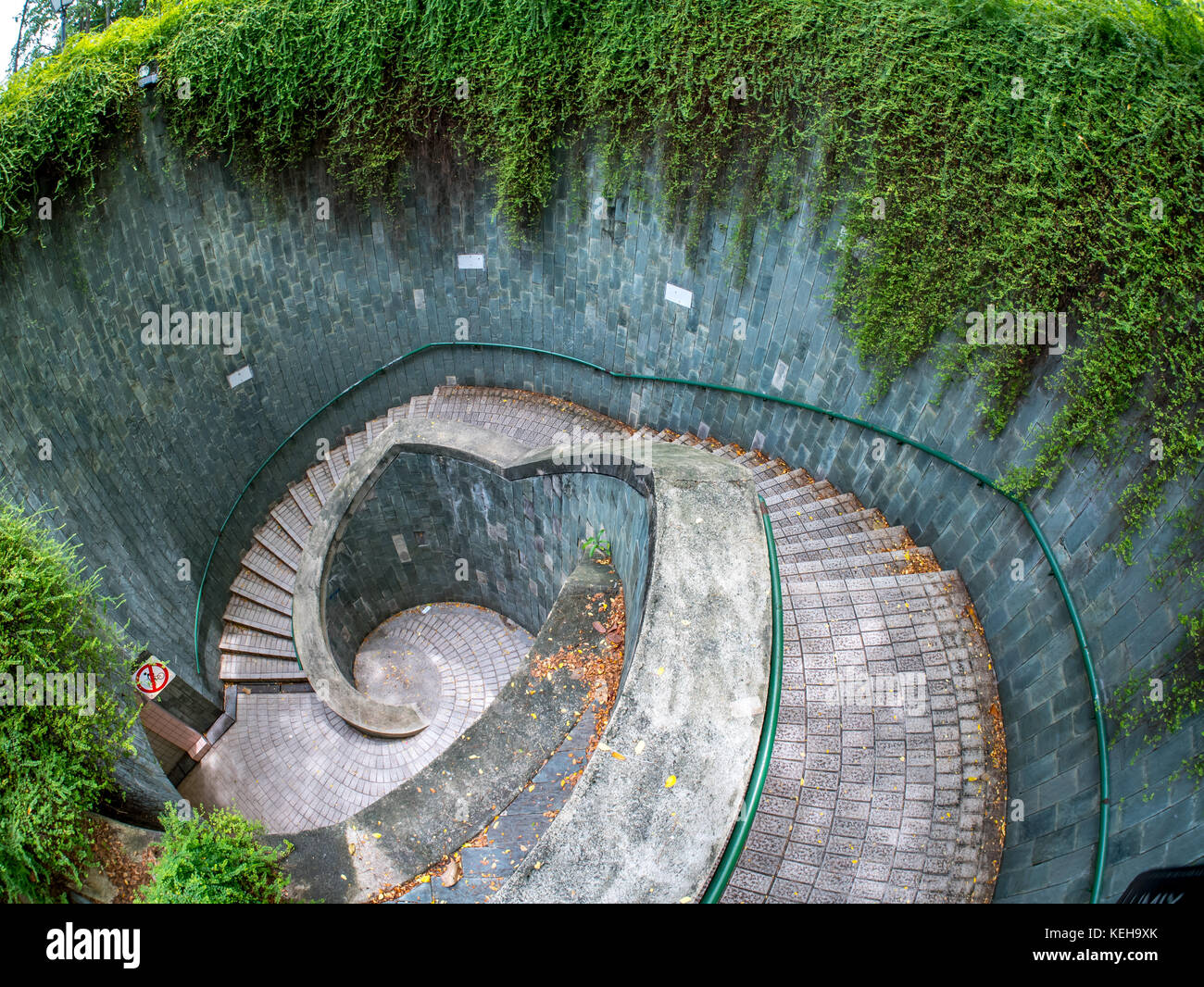 Spiral staircase of underground crossing in tunnel at Fort Canning Park, Singapore Stock Photo