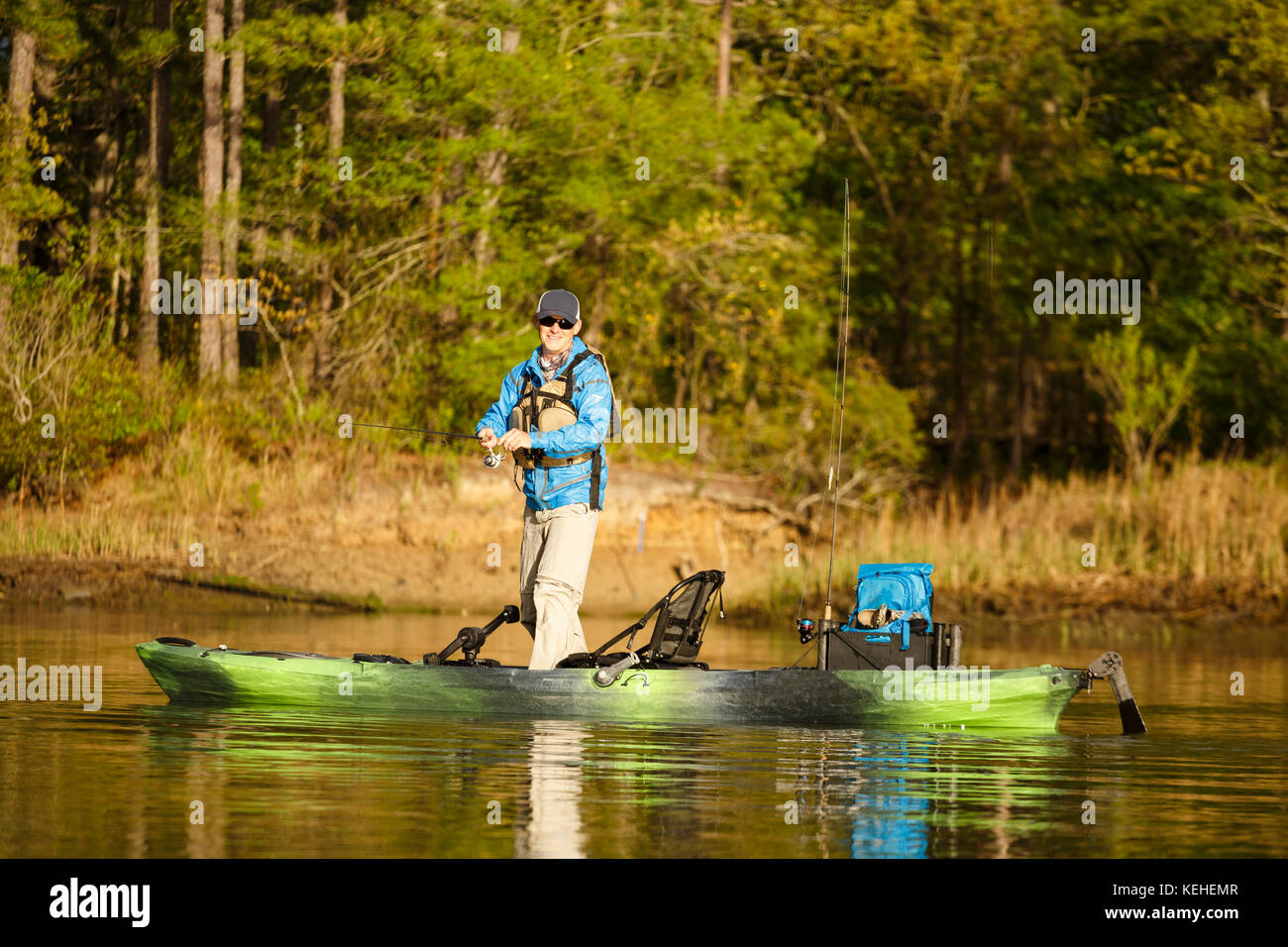 Caucasian man fishing on kayak Stock Photo