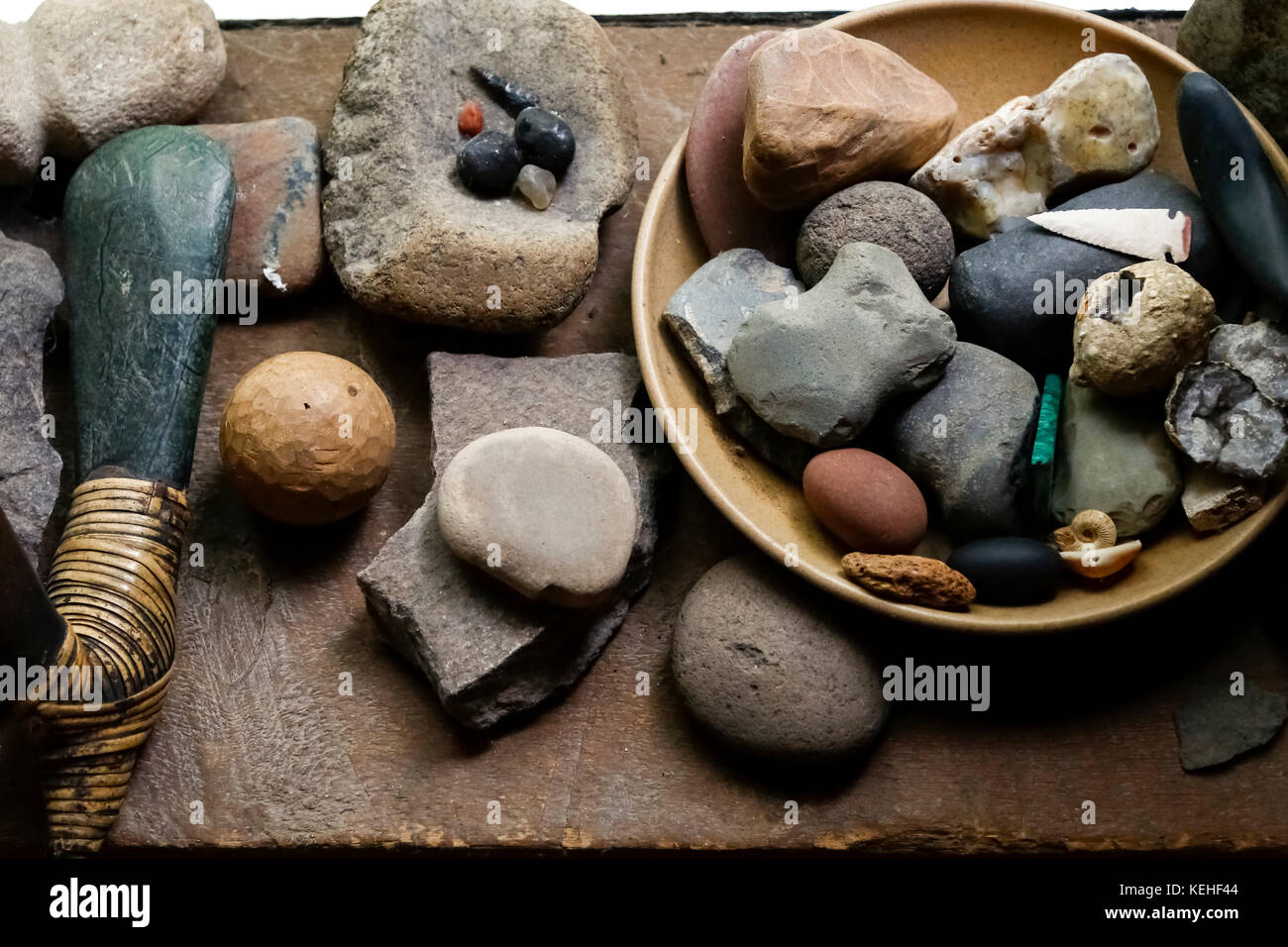 Stones in bowl and traditional tools Stock Photo