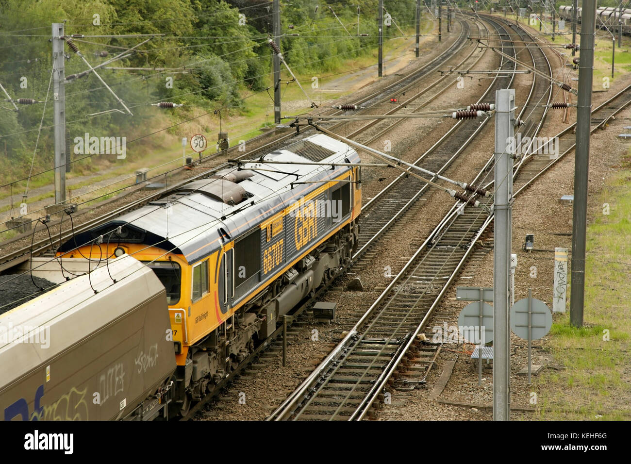 GBRf class 66 diesel locomotive 66707 with southbound coal train passing Holgate sidings south of York station, UK. Stock Photo