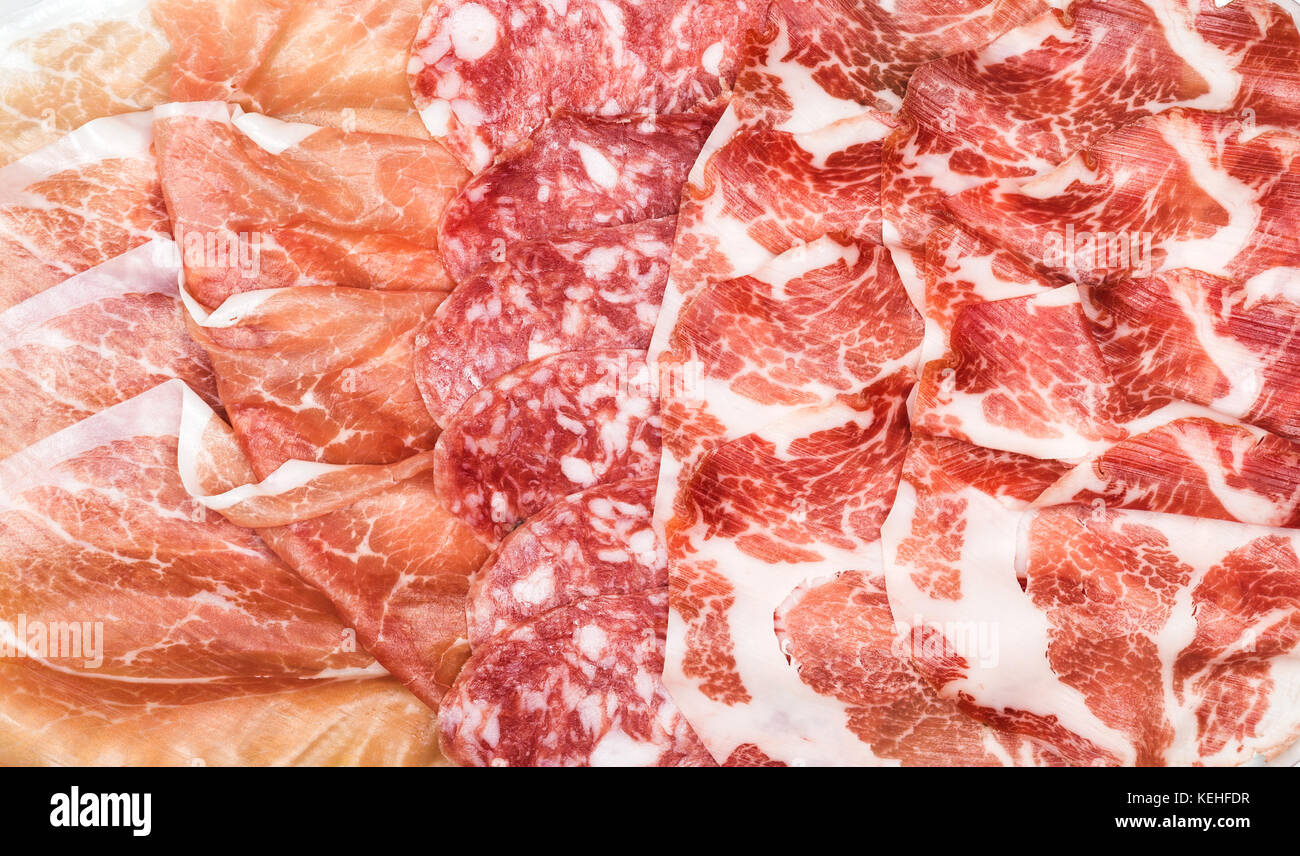 Antipasti composition of italian cured meat types. Salami, ham and