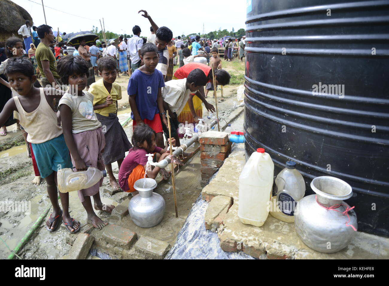 Rohingya children are collects drinking water from the WaterTank at the ...