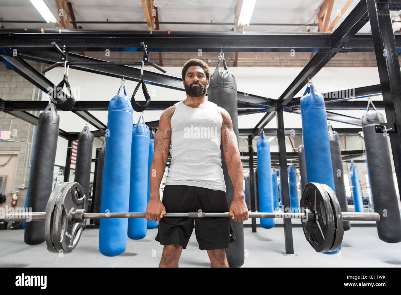 Lifting heavy bag hi-res stock photography and images - Alamy