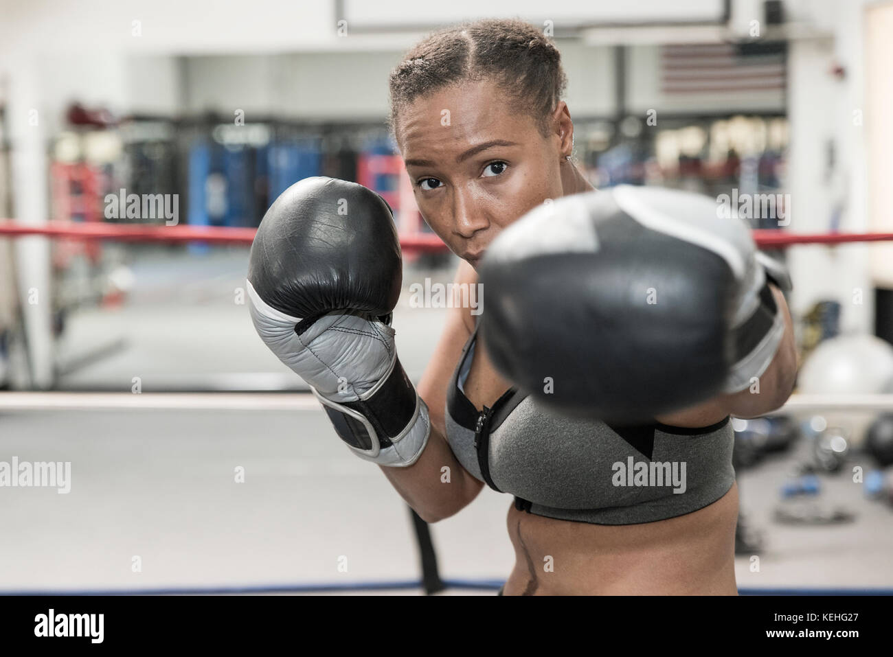 Black woman posing in boxing ring Stock Photo