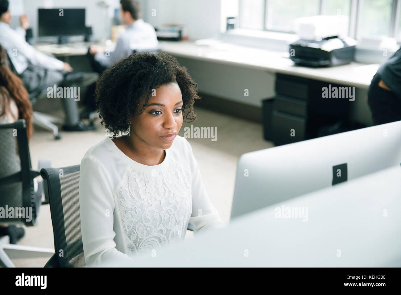 Businesswoman using computer in office Stock Photo