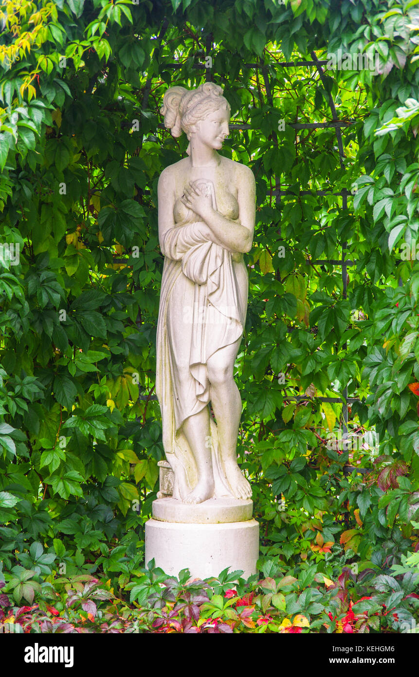 Decorative statue of a female in a garden Stock Photo Alamy