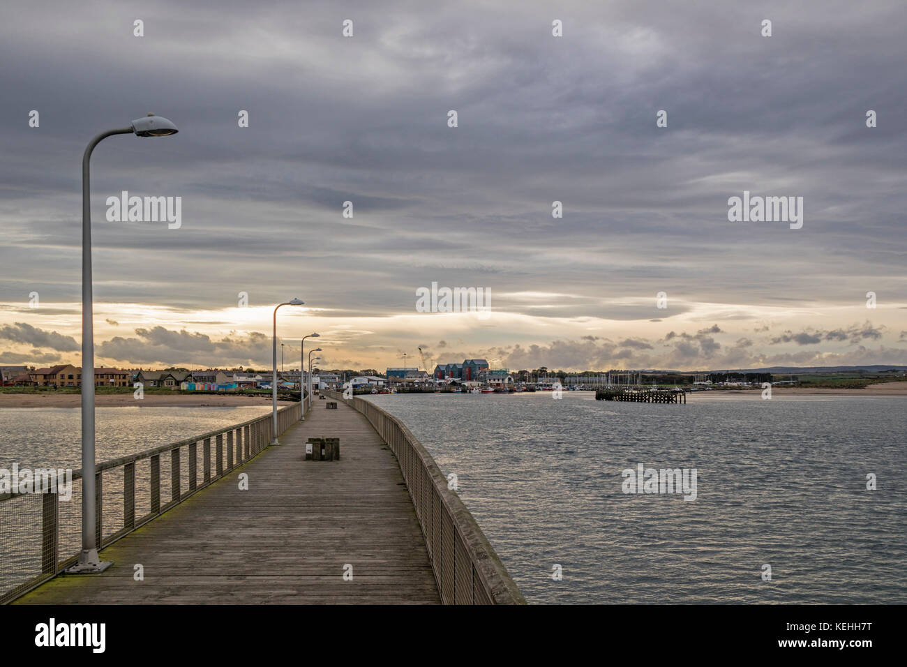 Looking towards the coastal town of Amble from Amble Pier, Northumberland, UK Stock Photo