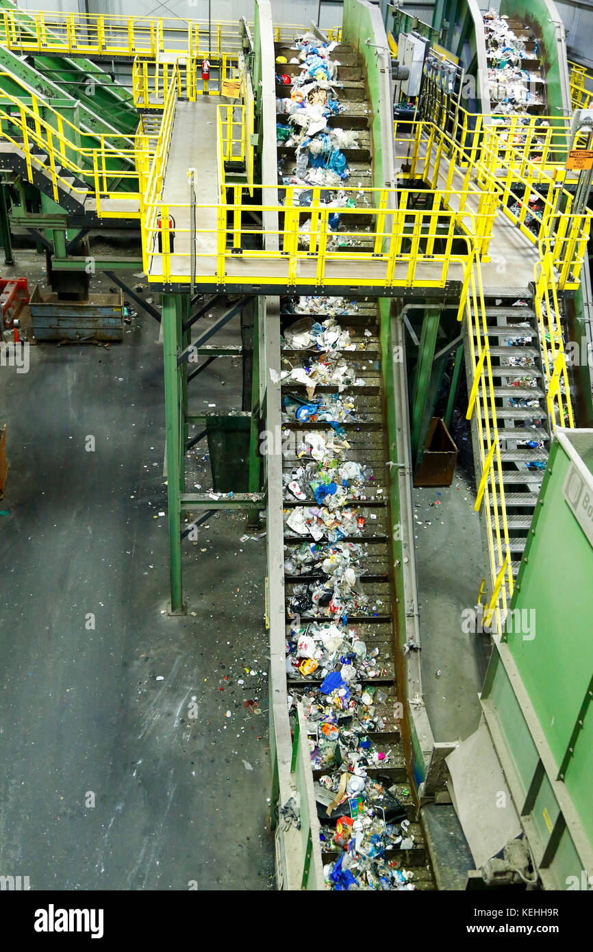 Trash on conveyor belt at factory Stock Photo - Alamy