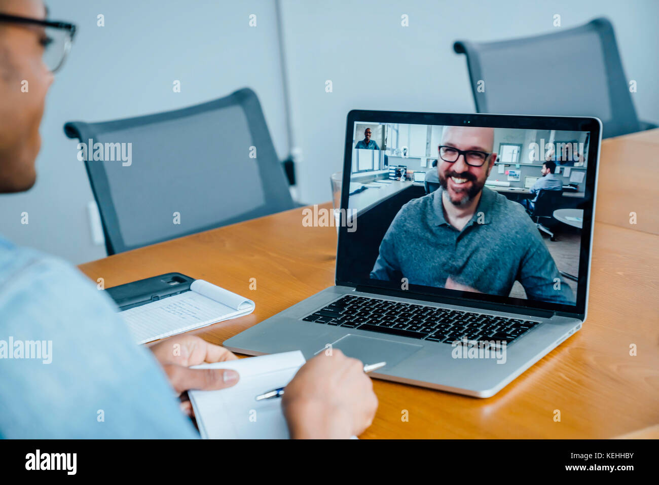 Businessmen on video conference Stock Photo