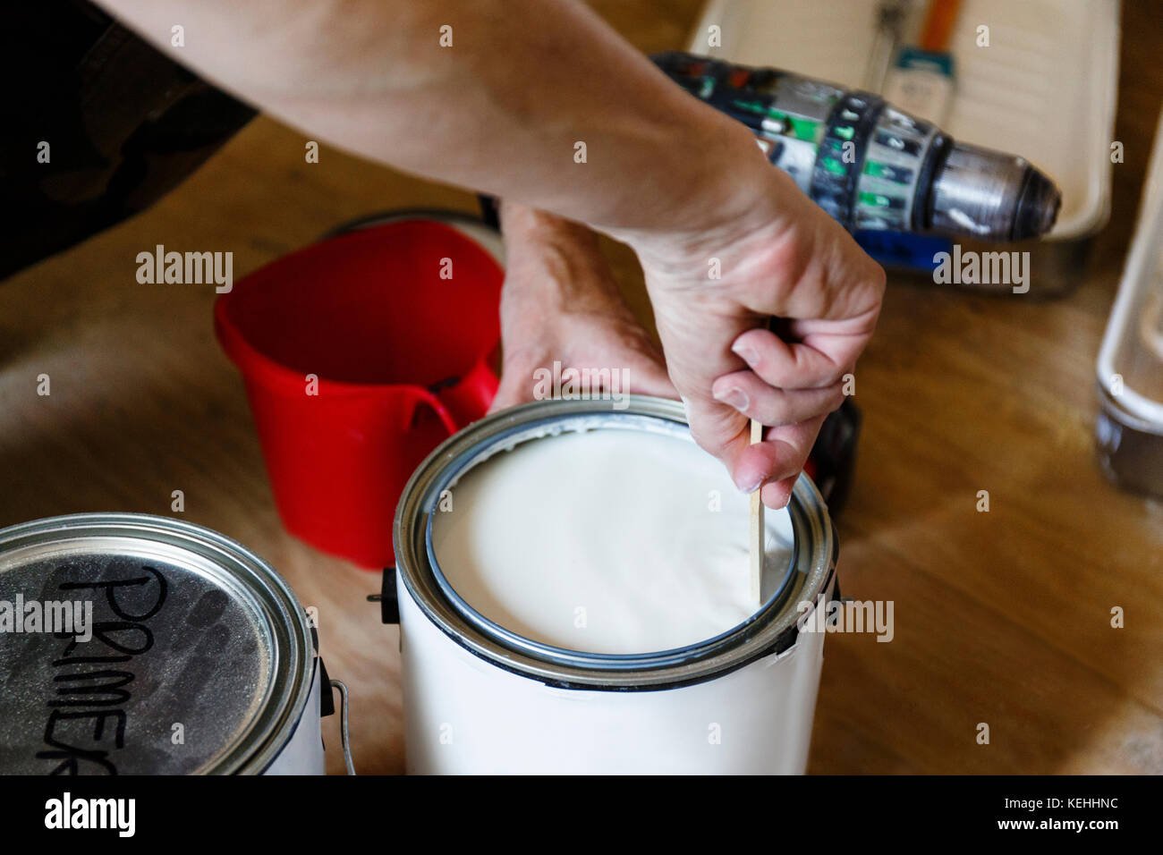 Hand of native American woman stirring paint Stock Photo