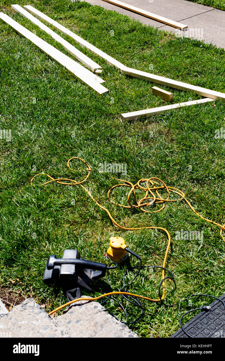Tools laying in grass Stock Photo