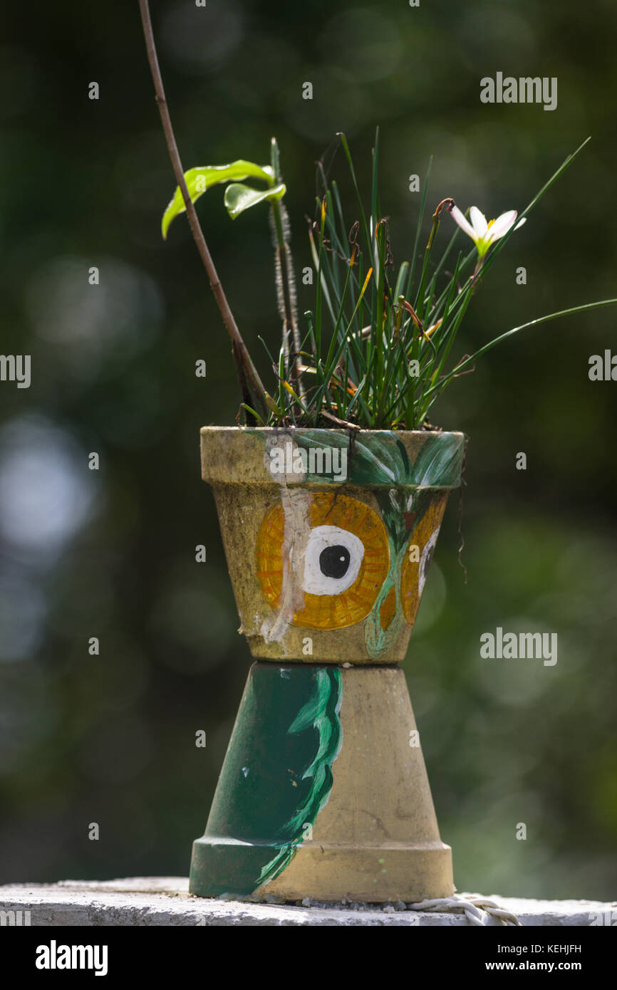Garden decor ideas from angels to painting flower pots Stock Photo