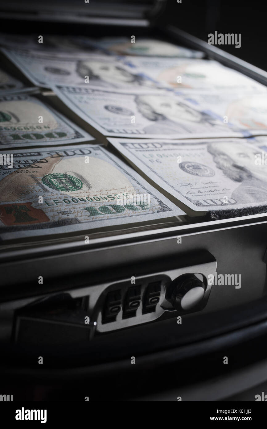 Briefcase filled with the money Stock Photo