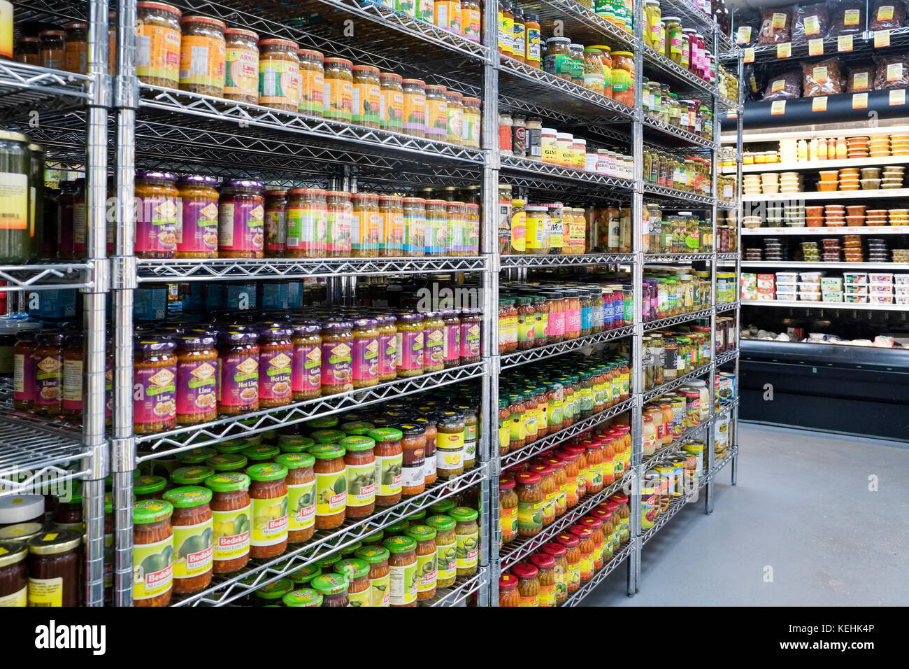 Jars of food in supermarket aisle Stock Photo