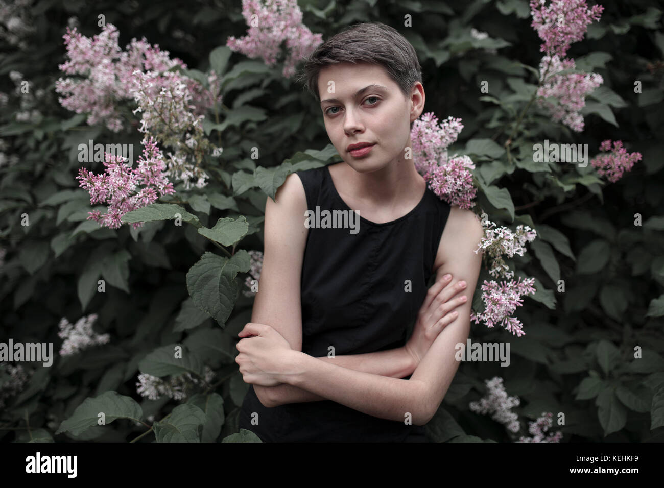 Angry woman folded arms in hi-res stock photography and images - Alamy
