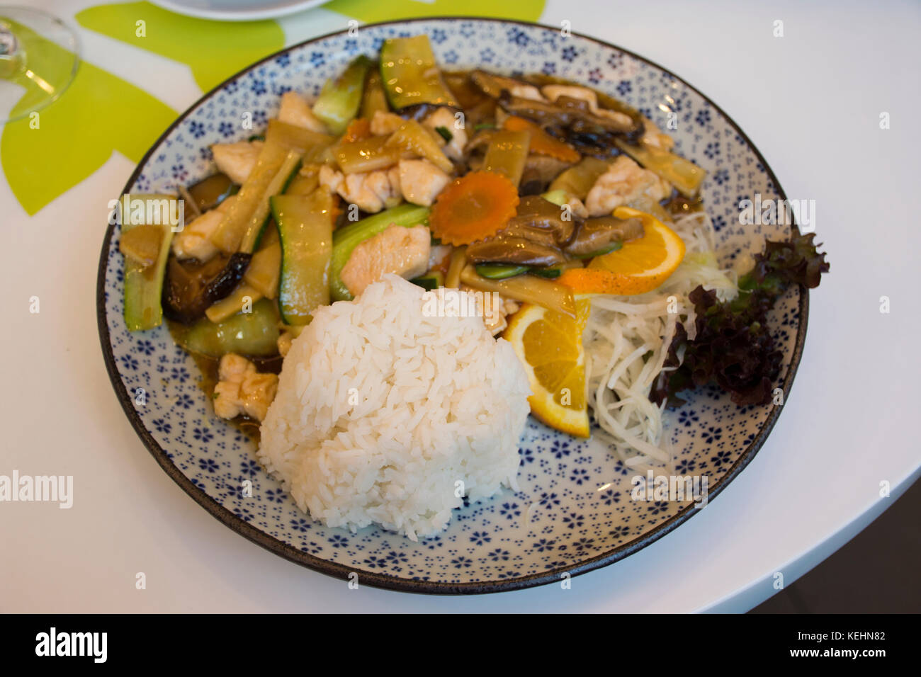 Stir Fried Vegetables with chicken and sweet sauce on top rice with