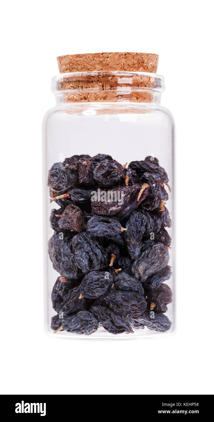 Black Raisins in a glass bottle with cork stopper, isolated on white ...