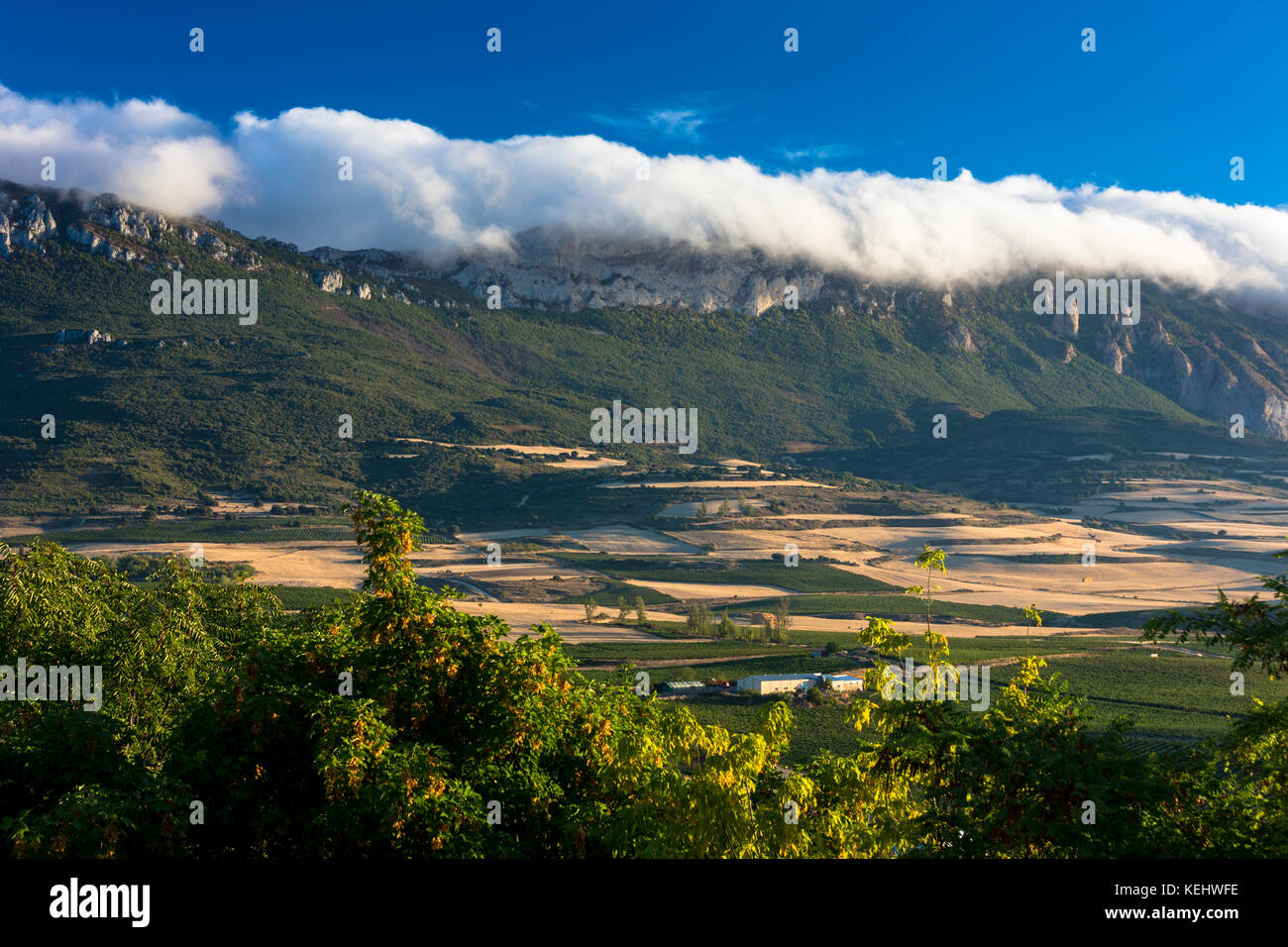 Weather front low cloud over mountains at Laguardia in Rioja-Alavesa wine-producing area, Spain Stock Photo