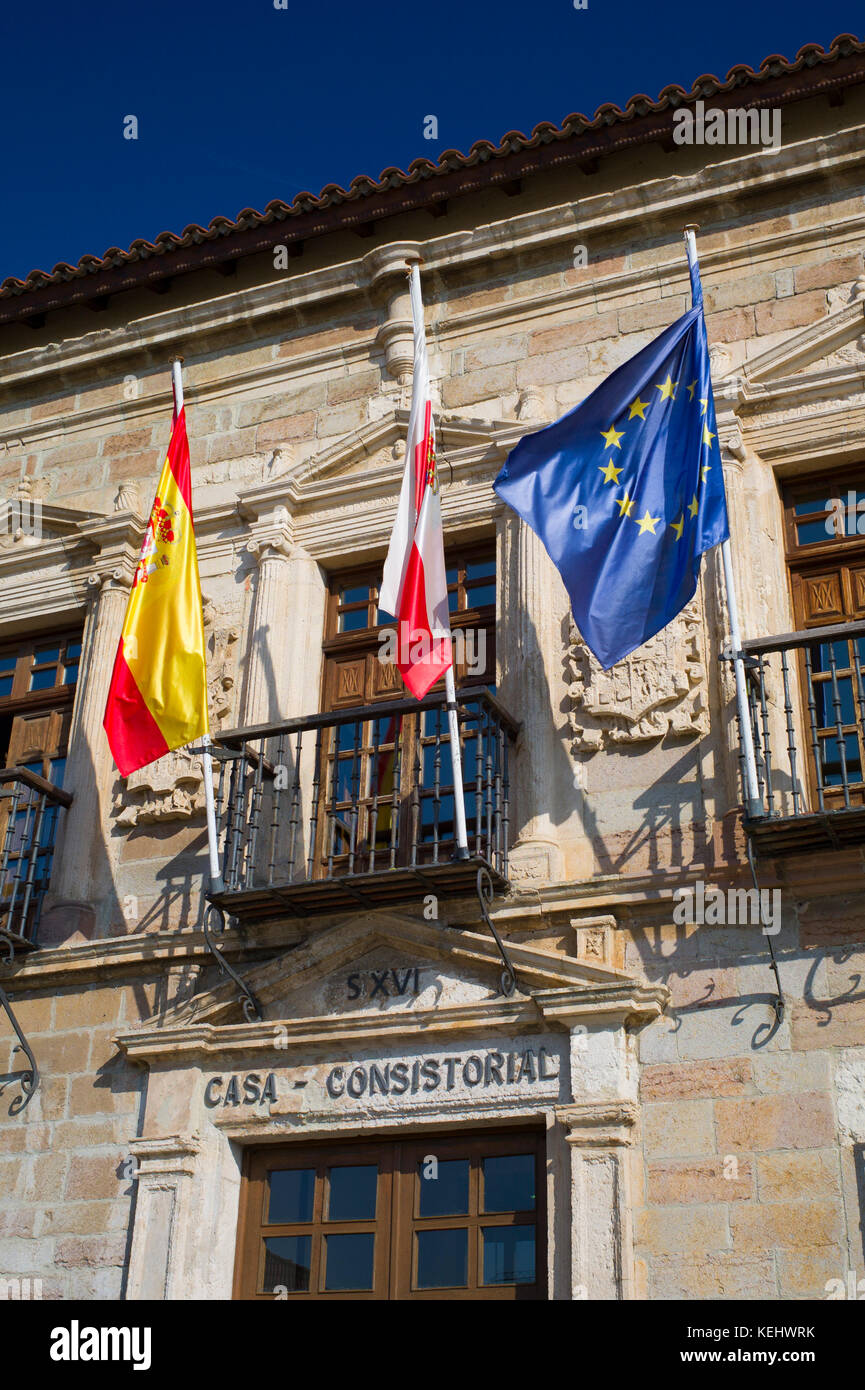 Ayuntamiento, County Hall, 16th Century with flags of Cantabria, Spain and EU in San Vicente de la Barquera, Northern Spain Stock Photo