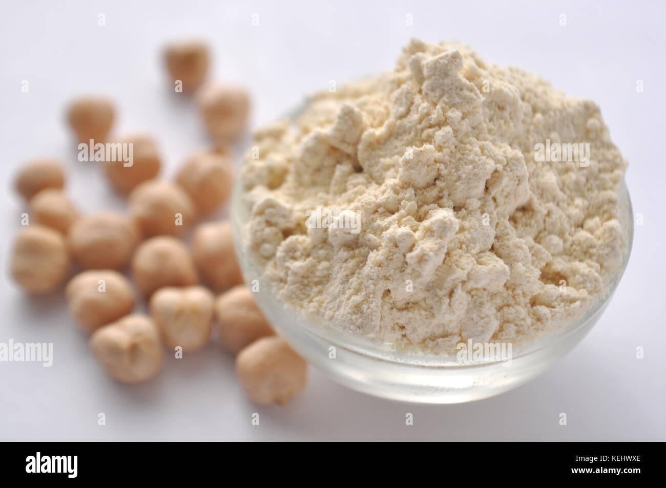 Chickpea flour and chickpeas isolated on white. Alternative glutenfree