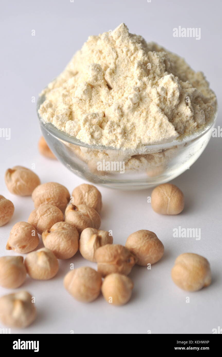 Chickpea flour and chickpeas isolated on white. Alternative glutenfree flour for baking and