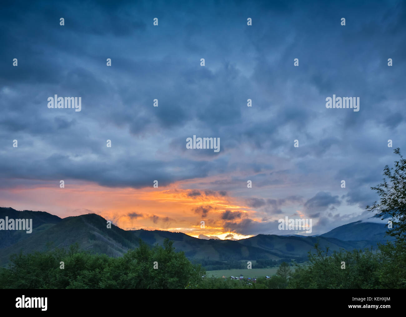 Beautiful dramatic sunset in the mountains. Landscape with sun light ...