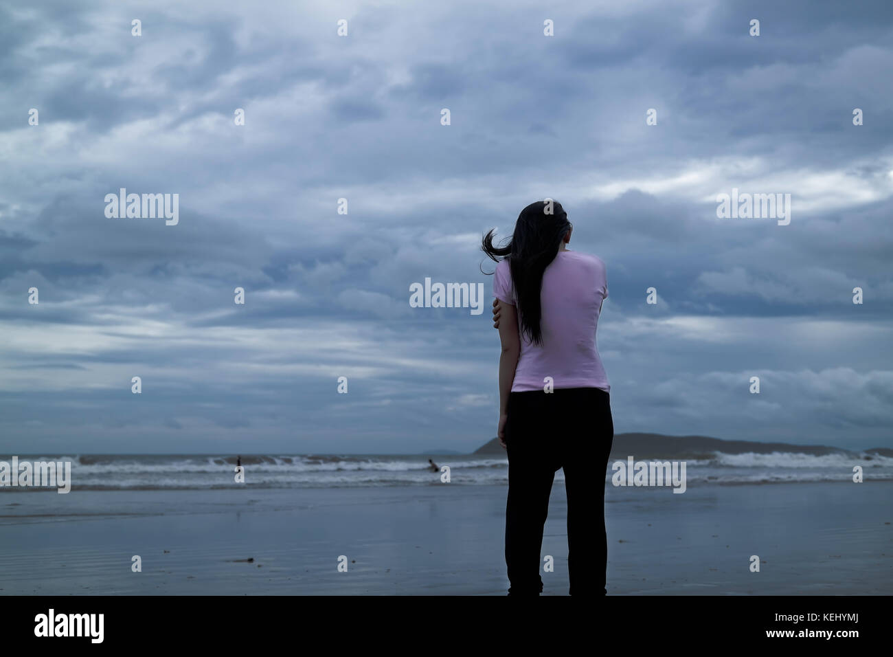 A woman standing on Bagasbas Beach Stock Photo Alamy