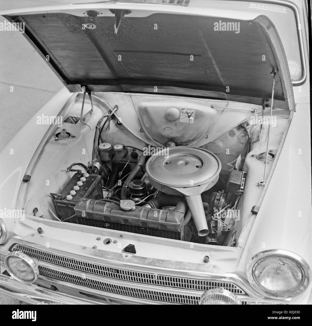 Press photos of the engine bay of  a 1966 Ford Cortina Mk 1 GT, shown outside Newspaper House in London. Photos taken on 21st October 1966. Stock Photo