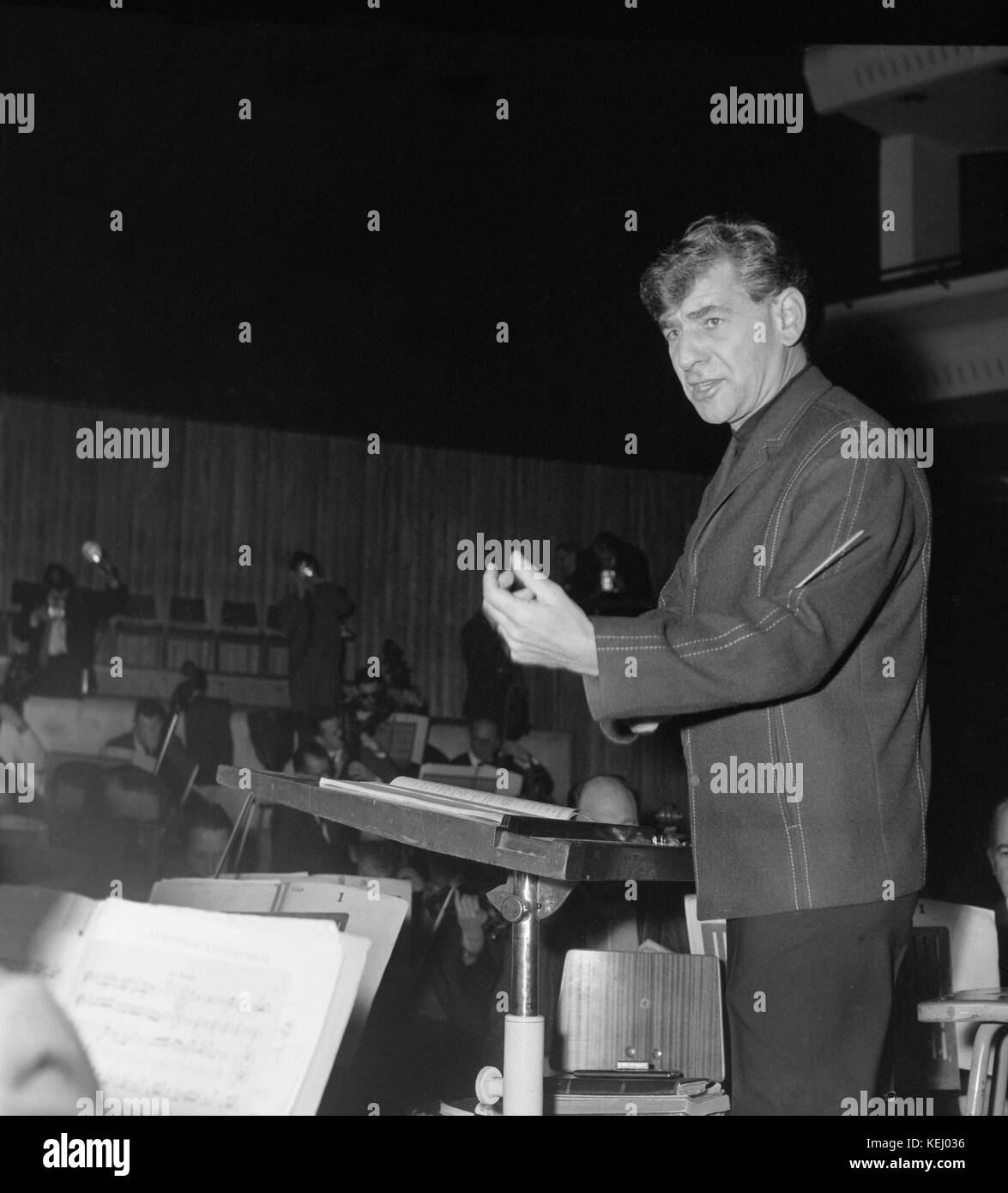 Conductor Leonard Bernstein in rehearsals with the New York Philharmonic Orchestra on 13th February 1963. Leonard Bernstein (August 25, 1918 – October 14, 1990) was an American composer, conductor, author, music lecturer, and pianist. He was among the first conductors born and educated in the US to receive worldwide acclaim. According to music critic Donal Henahan, he was 'one of the most prodigiously talented and successful musicians in American history. Stock Photo