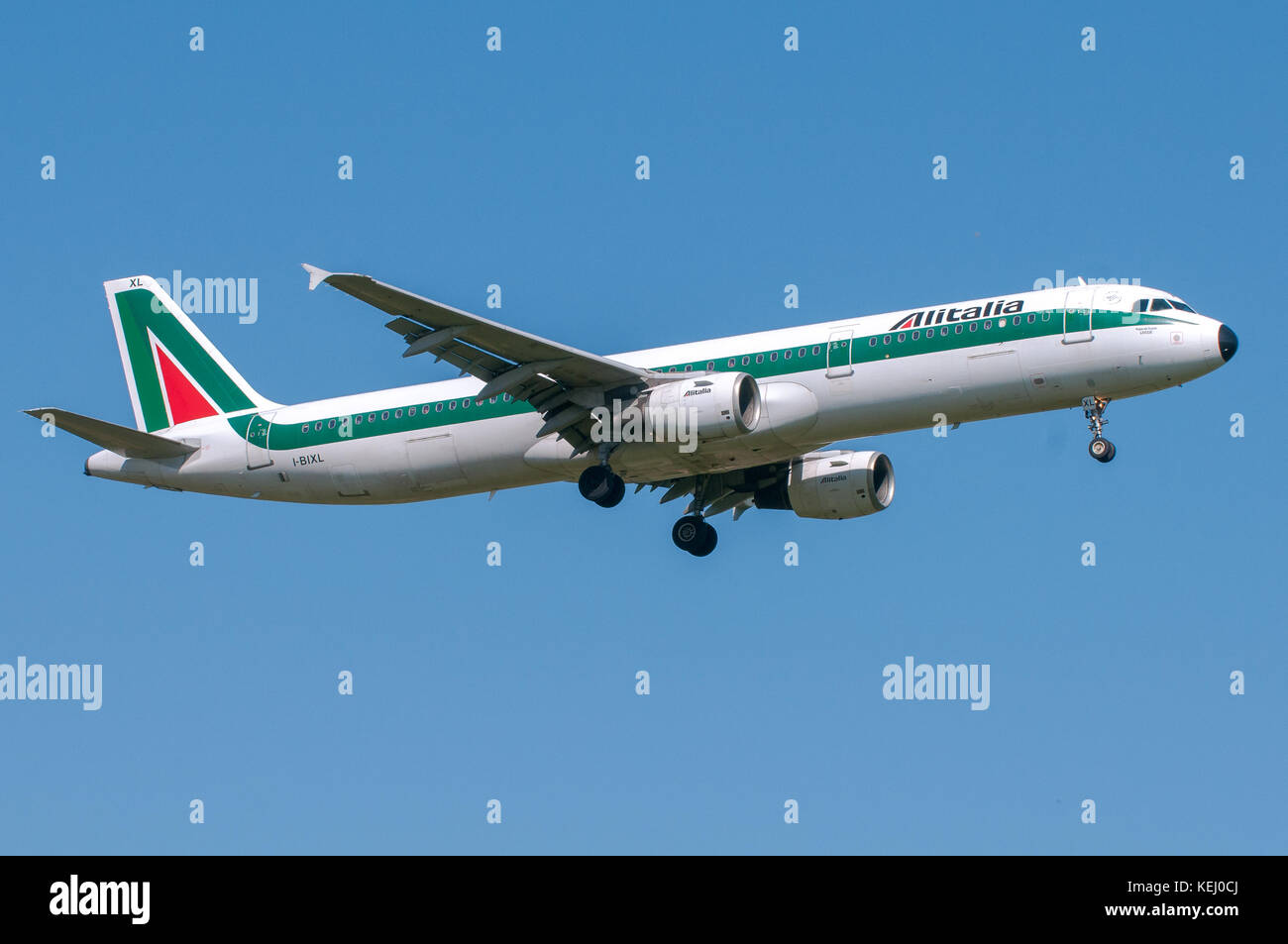London, UK, April 9 2011: 2-engines Airbus A321 of Alitalia italian national carrier landing at Heathrow airport. Stock Photo
