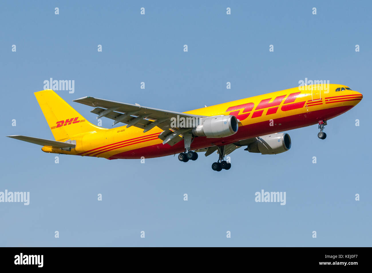 London, UK, April 9th 2011: an aircraft of international freight DHL in short final for landing at Heathrow. Stock Photo