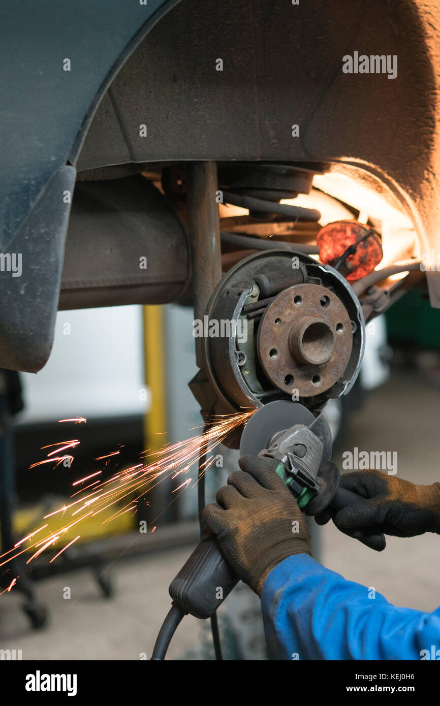 Closeup of car mechanic repairing brake pads Stock Photo Alamy