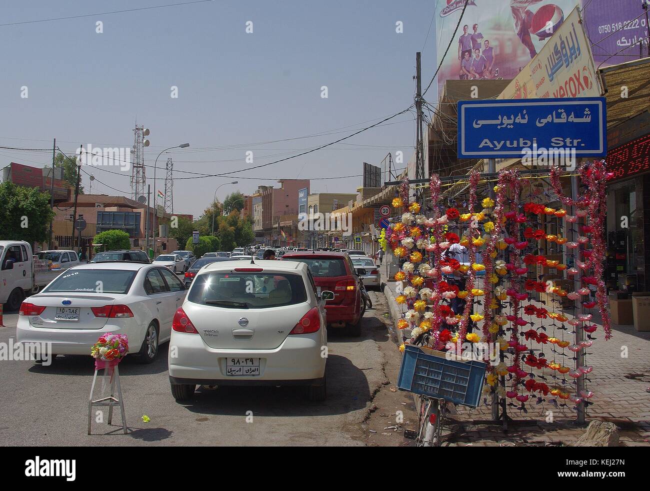 Erbil, the capital of Iraqi Kurdistan: Traffic and Shops at Ayubi street Stock Photo
