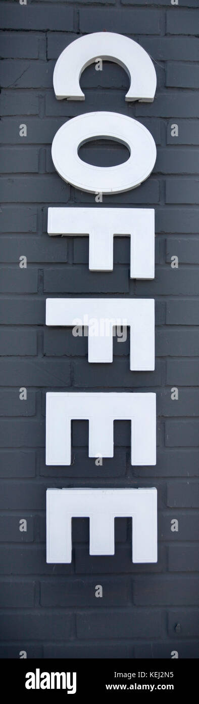 Simple white and grey brick COFFEE sign. Isolated. Vertical. Stock Photo