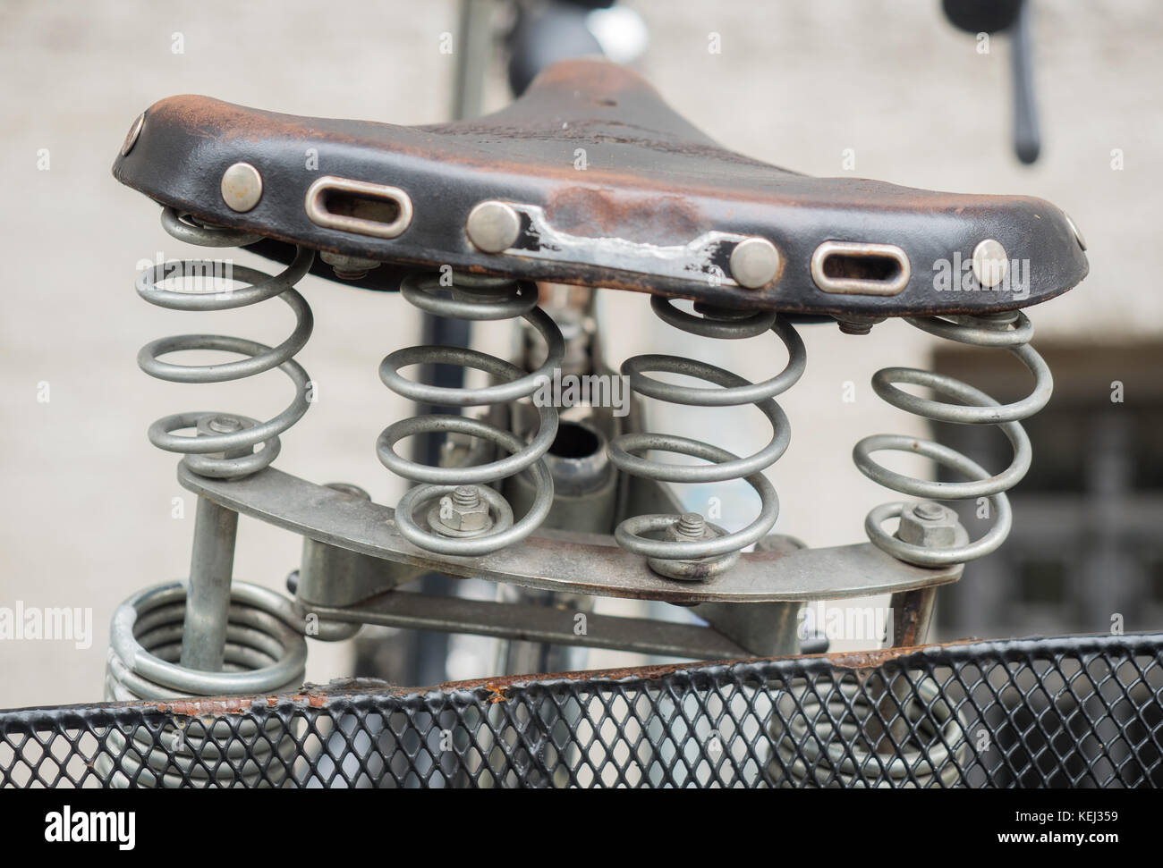 Bicycle saddle with springs and basket Stock Photo